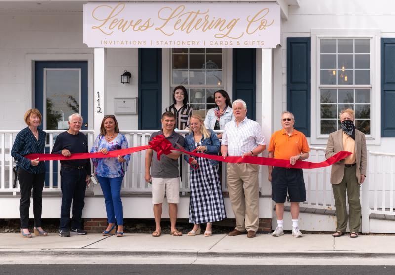 Lewes Lettering Co. recently hosted a ribbon-cutting ceremony with the Lewes Chamber of Commerce. In back are (l-r) Heather Garrity and Mary Maloney, Lewes Lettering Co. In front are Betsy Reamer, Lewes Chamber executive director; Dennis Reardon, Lewes City Council; Nikky Fisher, Lewes Chamber board president; Michael and Katy Ackerman, owners; Ted Becker, Lewes mayor; Fred Beaufait, Lewes deputy mayor; and Rob Morgan, Lewes City Council. Participants briefly removed face coverings for the photograph. SUBMITTED PHOTO